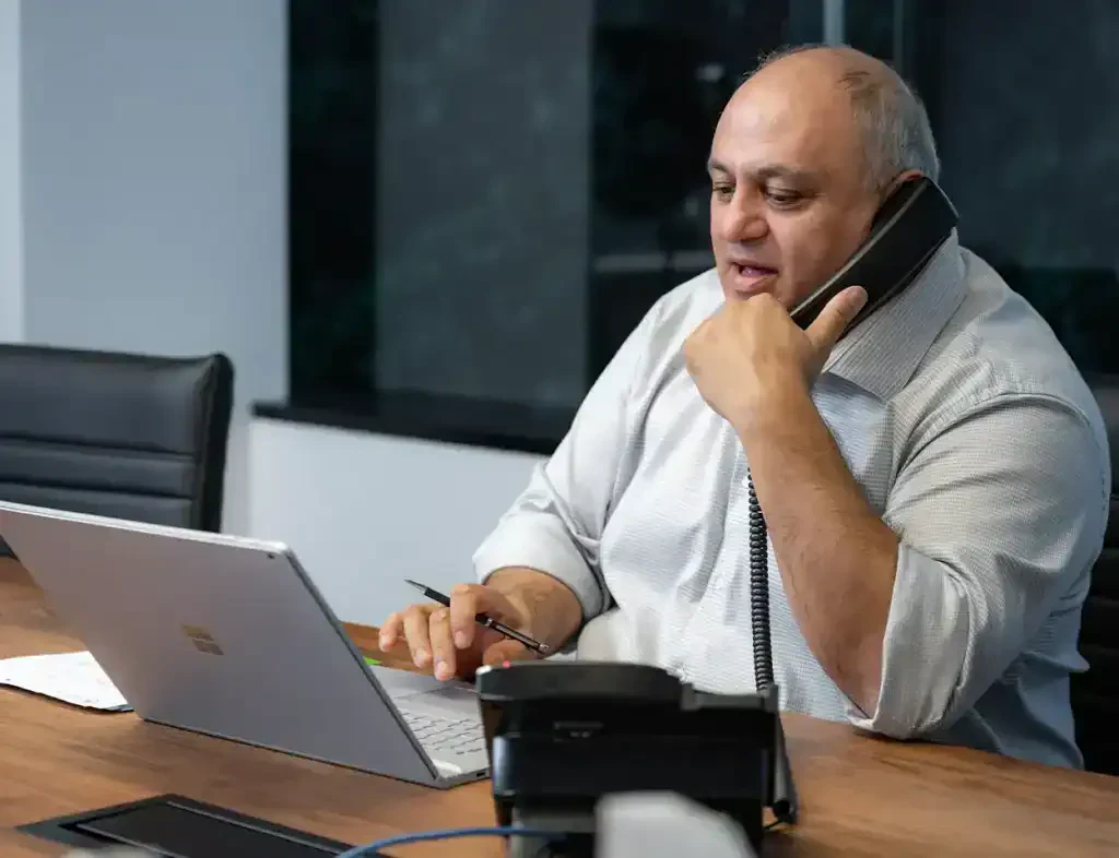 Fazel Mostashari working at his desk