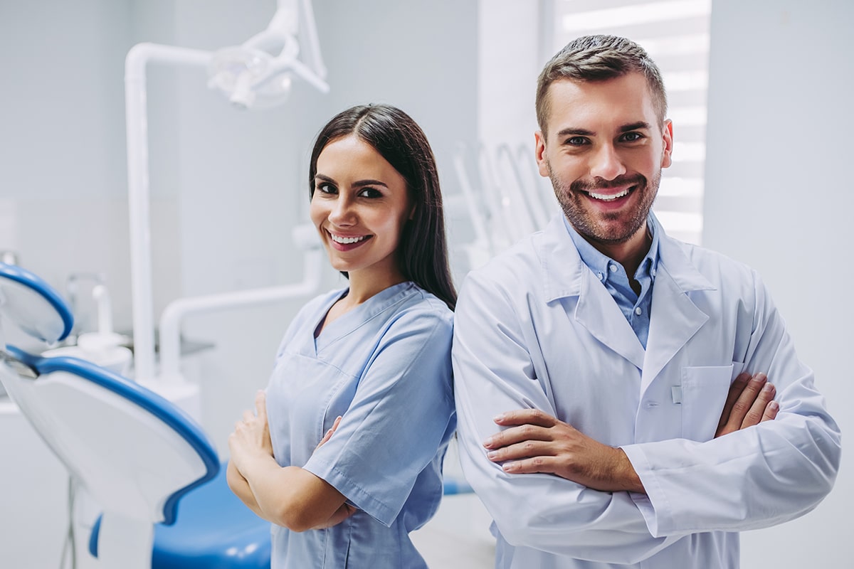 A photo of two dentists