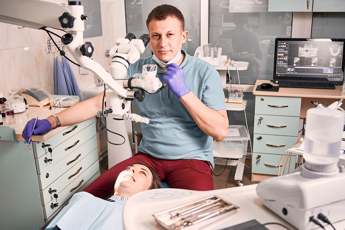 A photo of a dentist and a patient