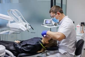 A photo of a dentist performing a dental procedure