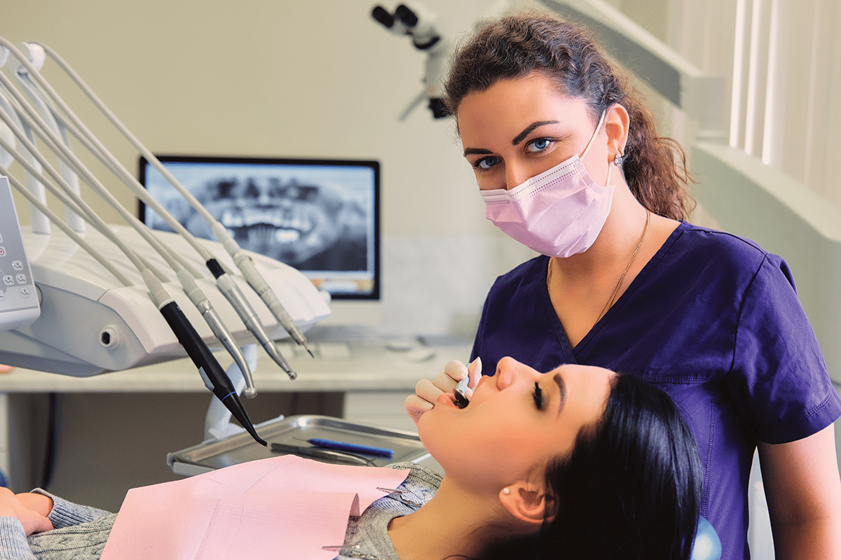 Dentist performing a dental procedure on a patient